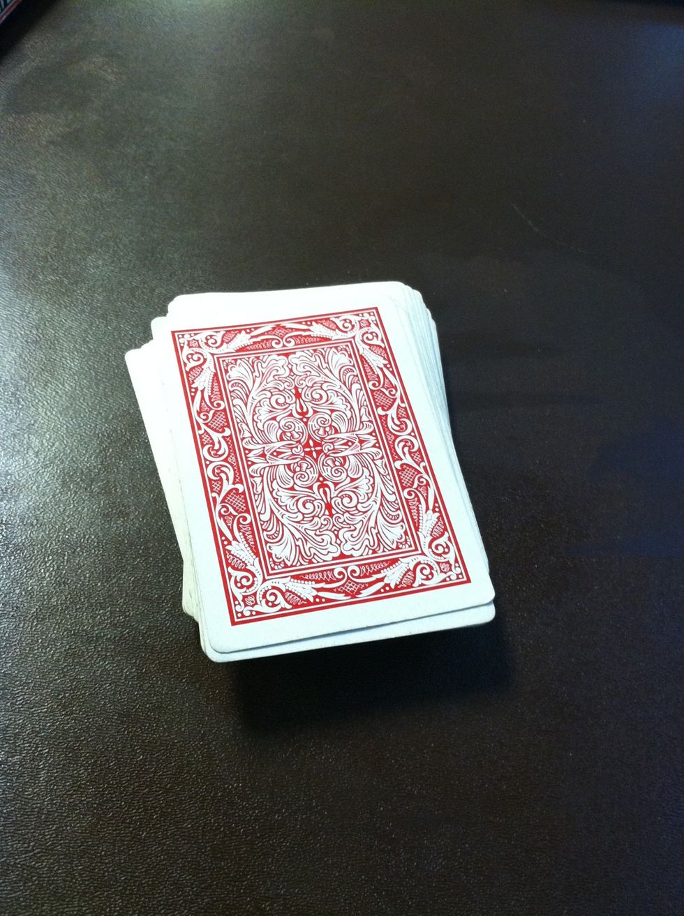 Now shuffle the cards just a little so you don't separate their card from the one you memorized.