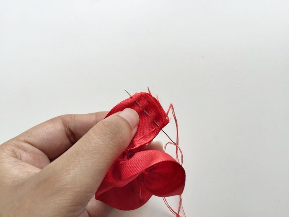 Now simply stitch both ends of the ribbon to from a circle.