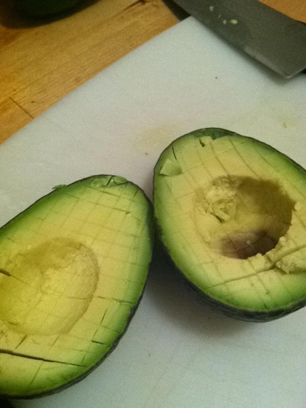 Now slice lines in it down to the outer skin. It should look like you drew a grid on it with your knife.