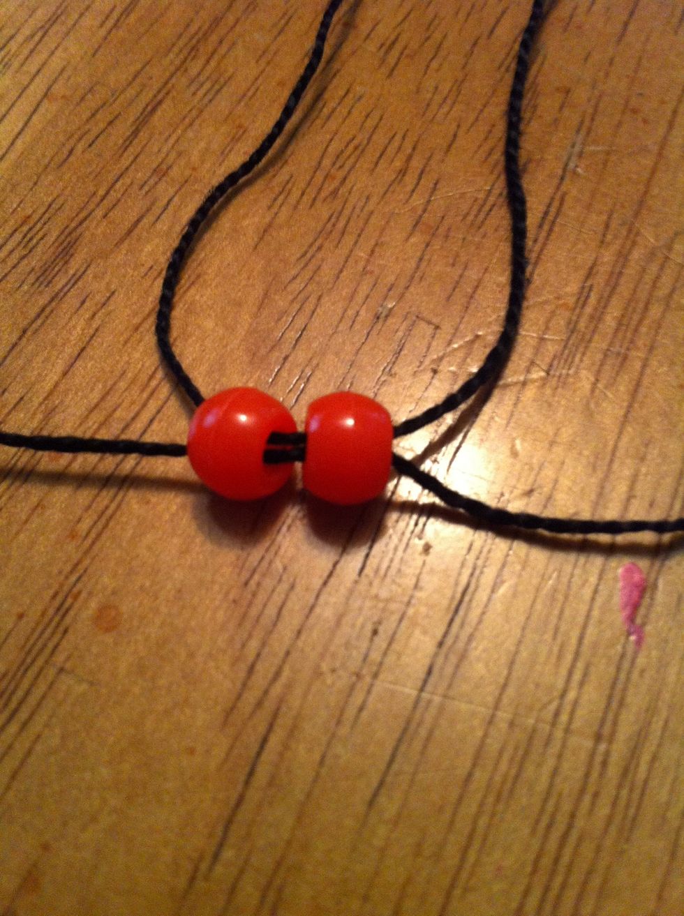 Now slip the other string through, also.