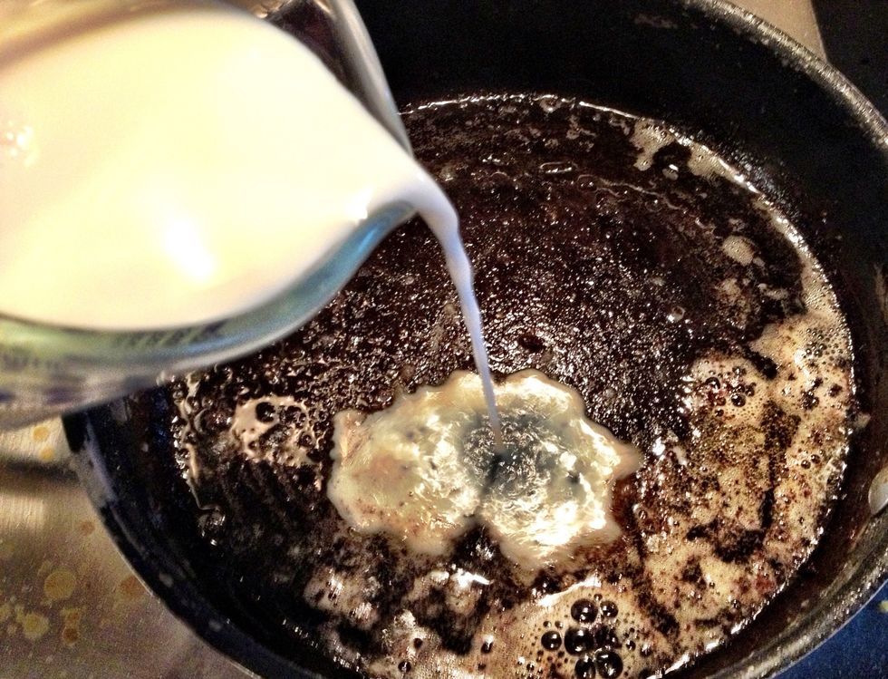 Now SLOWLY add a couple tbsp of milk. If you've never done this before, be careful - it may steam up quickly! Use your whisk to scrape the bits off the bottom of the pan.