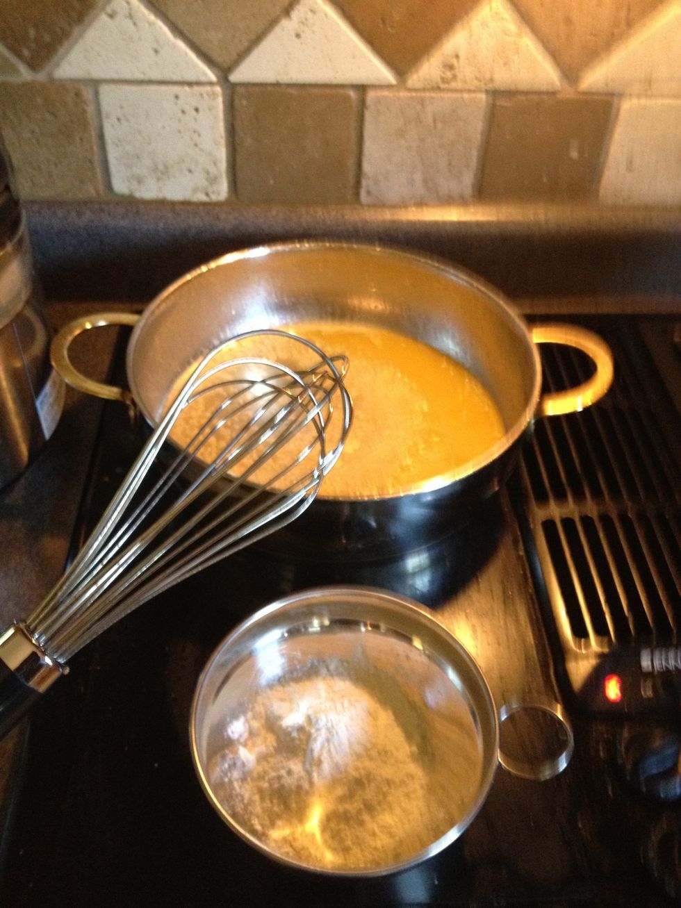 Now slowly whisk in flour
