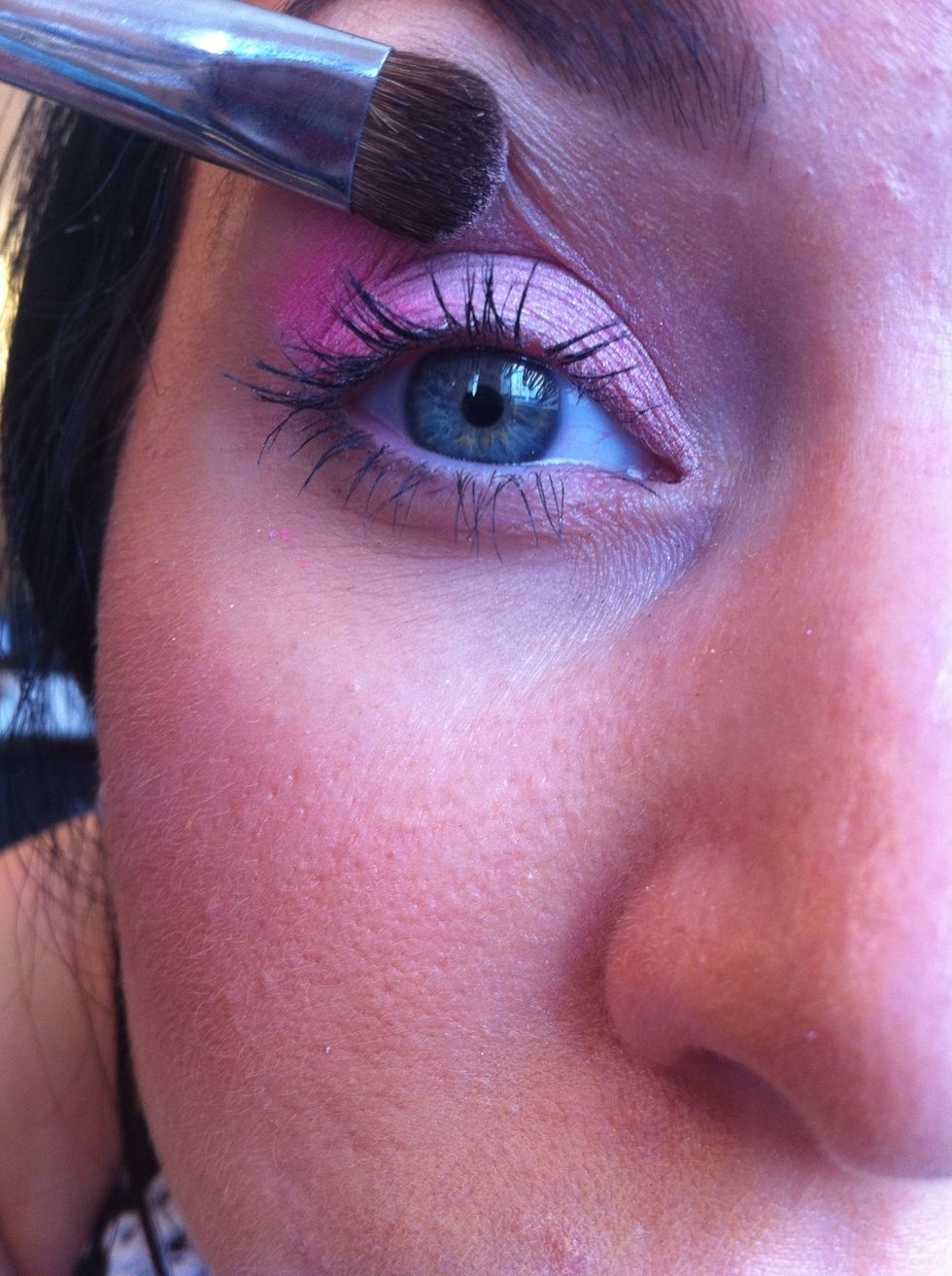 Now soften and blend all with a clean brush- Take a matte white/cream eyeshadow and apply this to the centre of the eyelid to blend all the colours together...