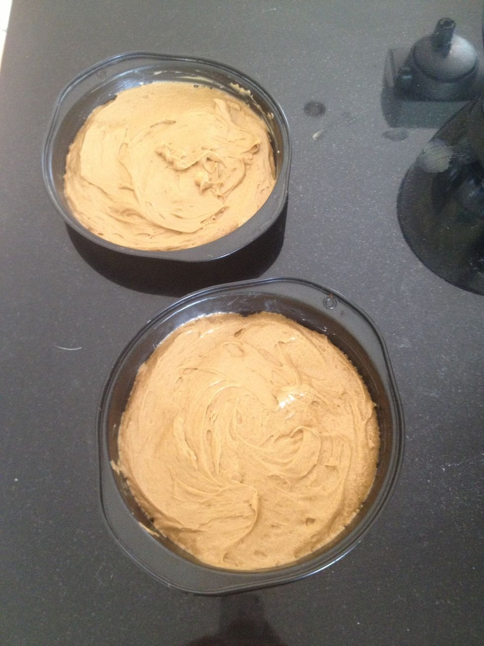 Now spread the mixture across the two lined tins from earlier.