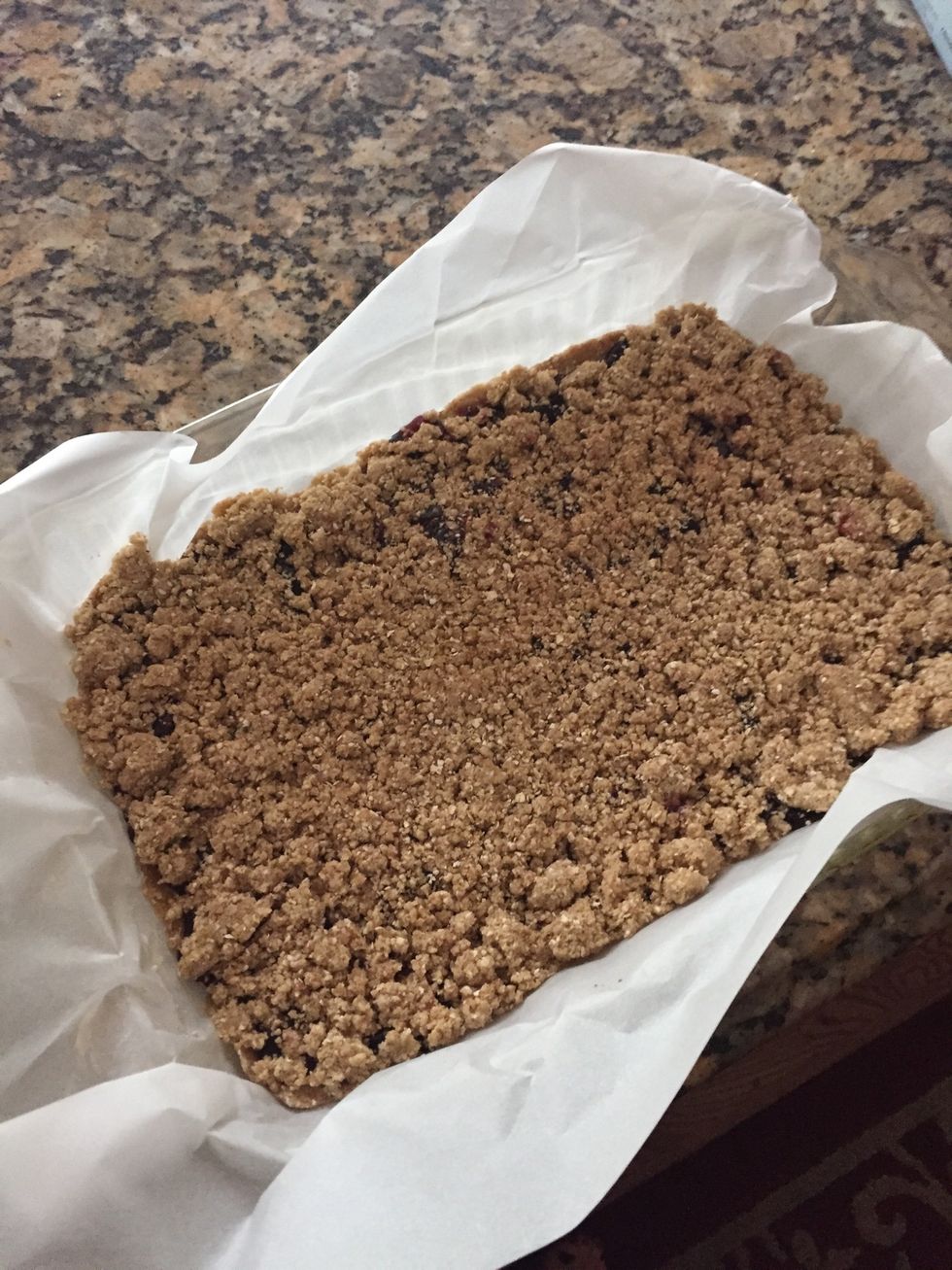 Now sprinkle and pat the rest of crumble on top of the preserves