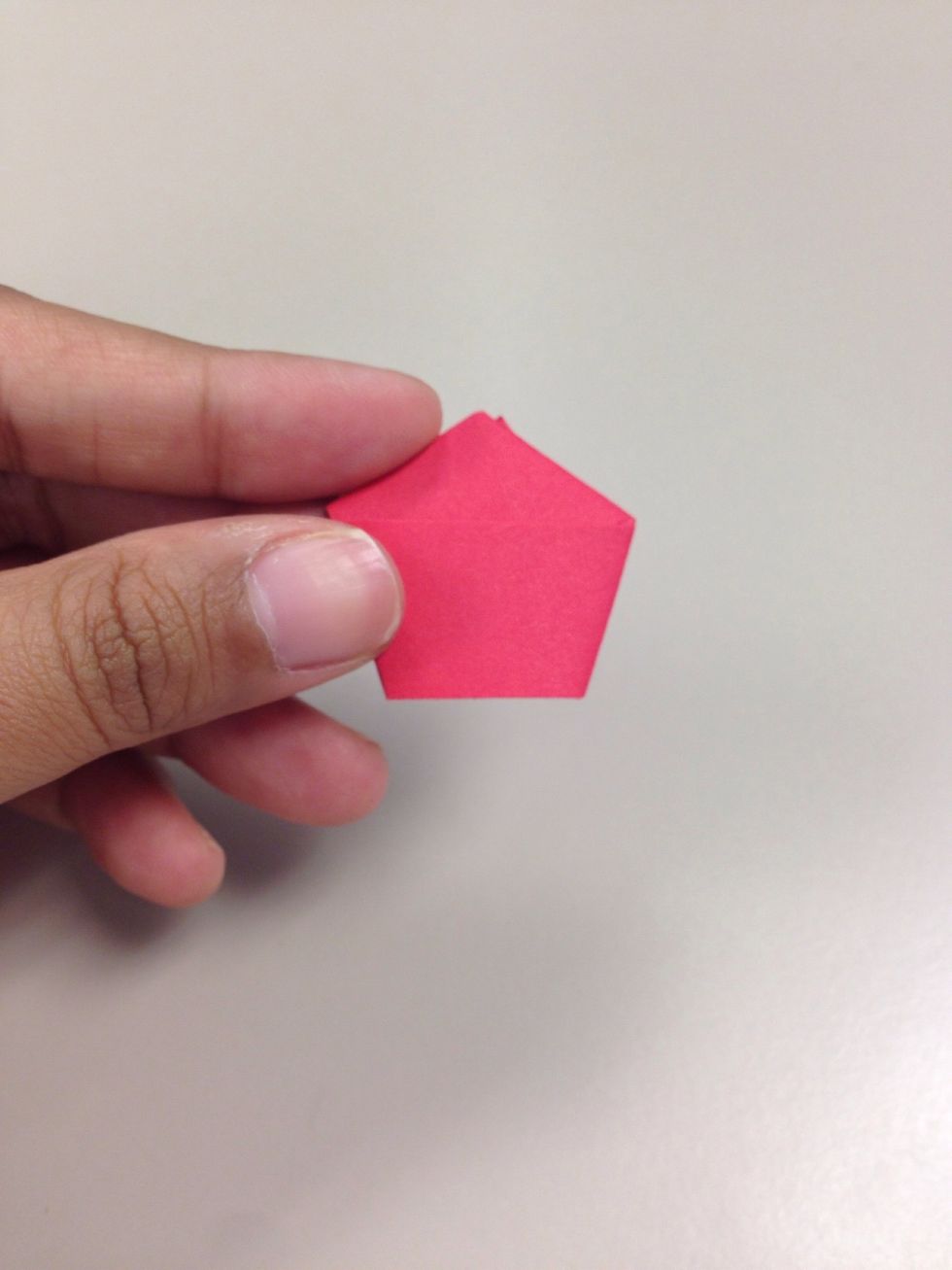 Now squish the sides of pentagon so that it puffs out