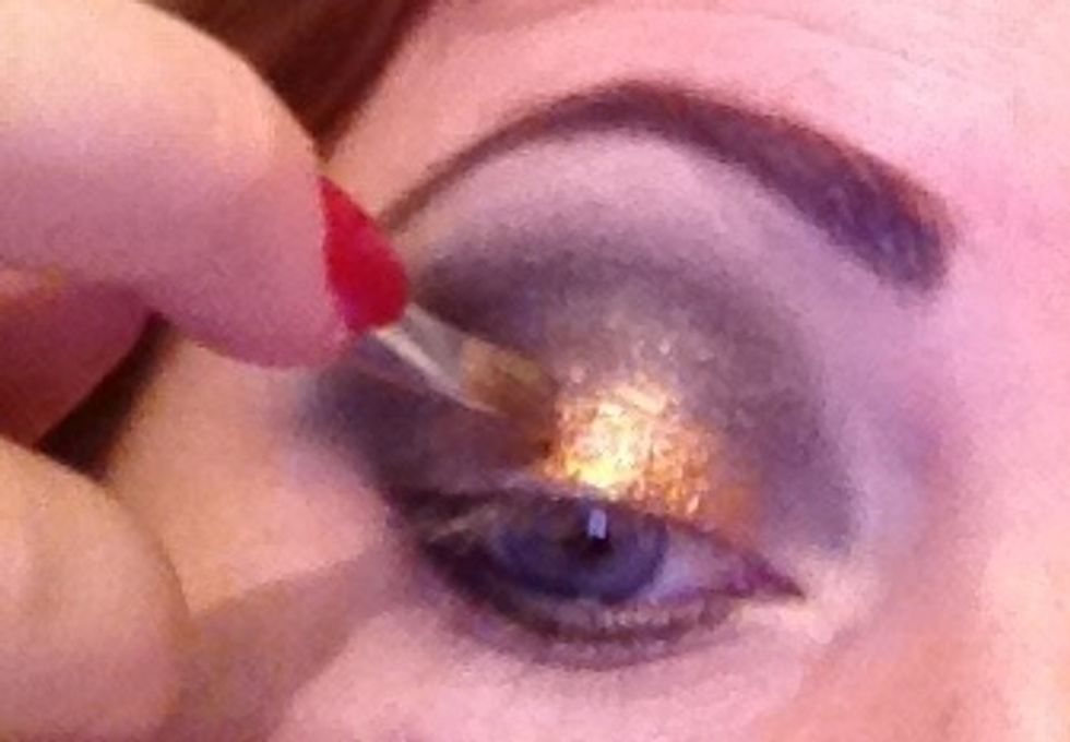 Now start adding the glitter I'm using a bronzey gold glitter but use what you like and what suits you and pat onto the bits where you have added glitter fixing gel.