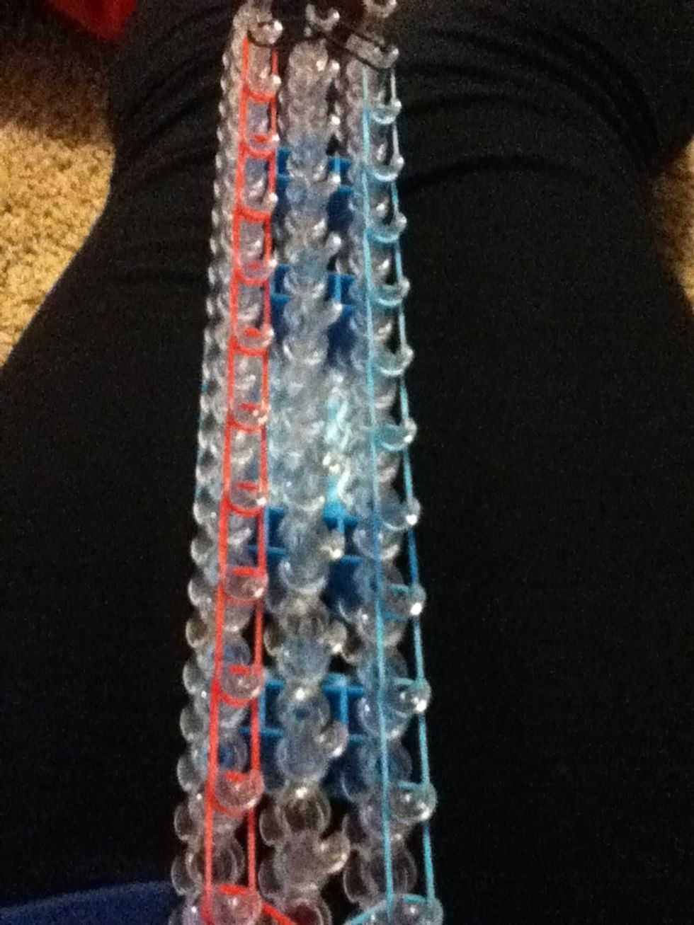 Now start at the bottom again and go all the way up at the second last peg ...well,you know the drill