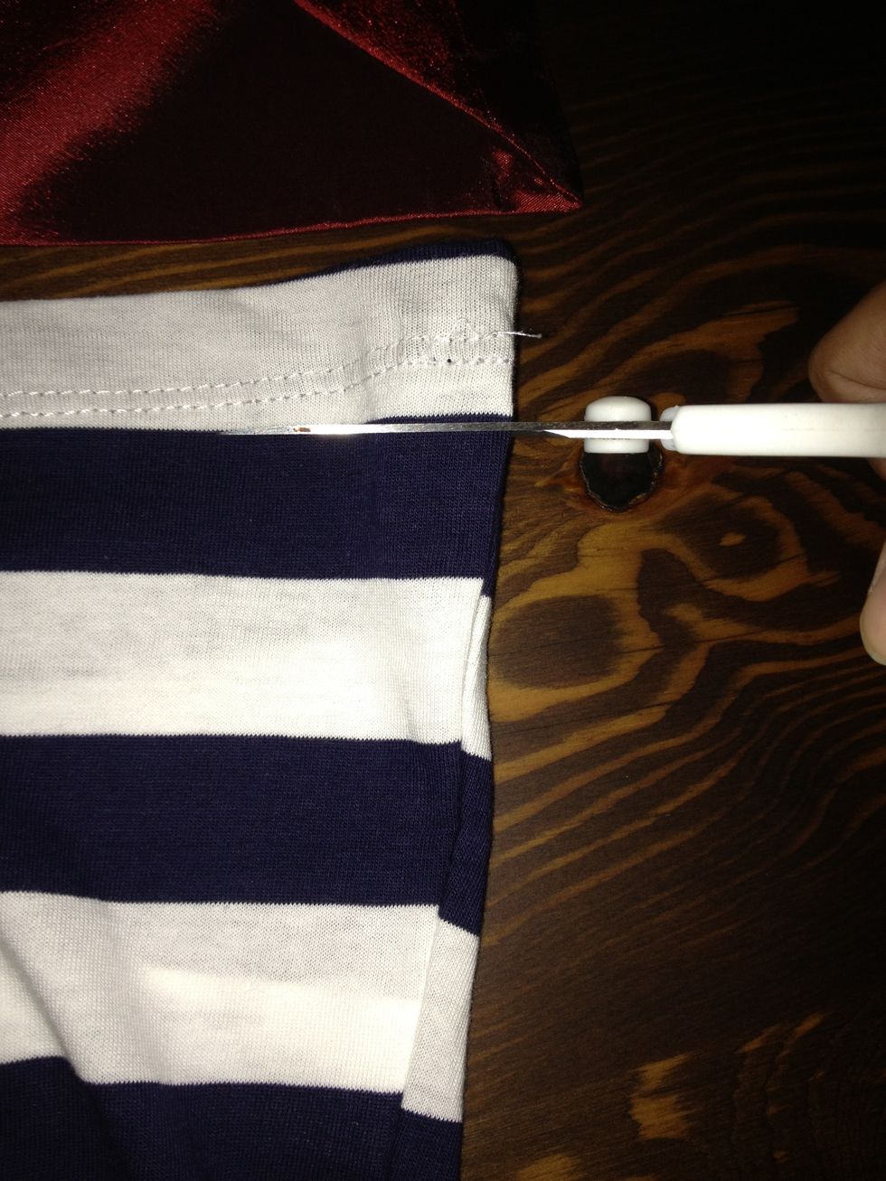 Now,start cutting the arms of the tote.