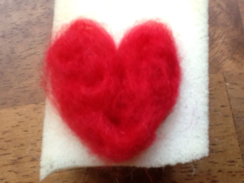 Now, start felting...poking the needles into the wool repeatedly...this weaves the loose wool together making a soft structure. (video follows, don't give up!)