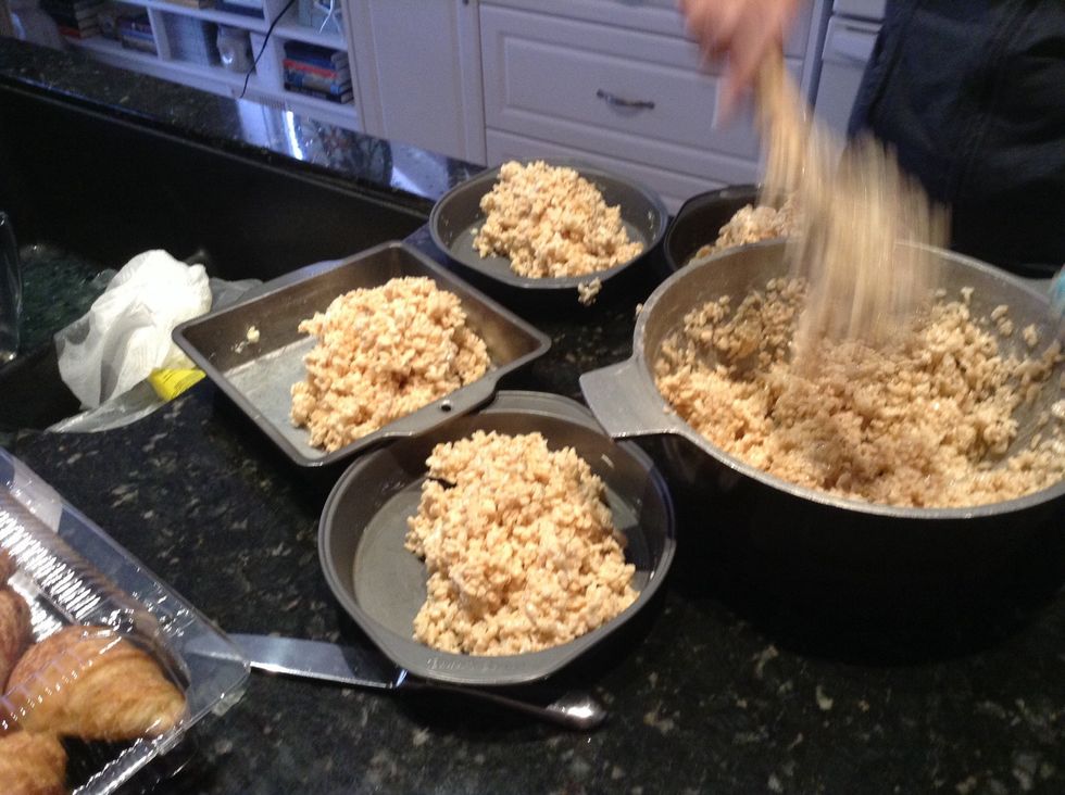 Now start putting the rice crispys in the pans