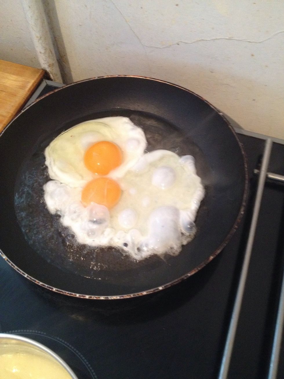 Now start to fry your eggs on a high heat and cook as desired