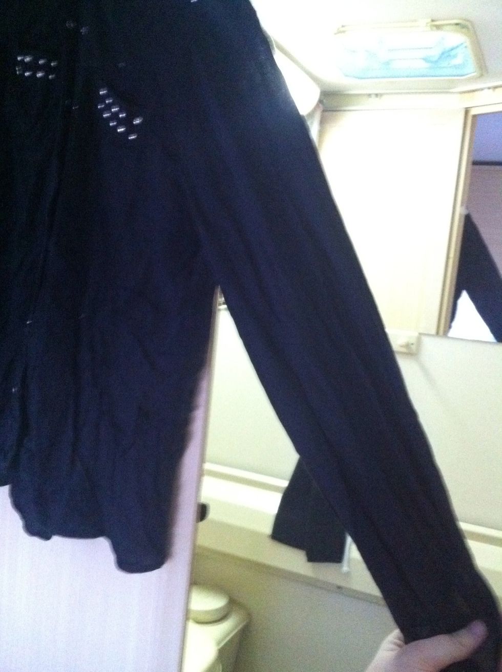 Now start to hold one sleeve with one hand
