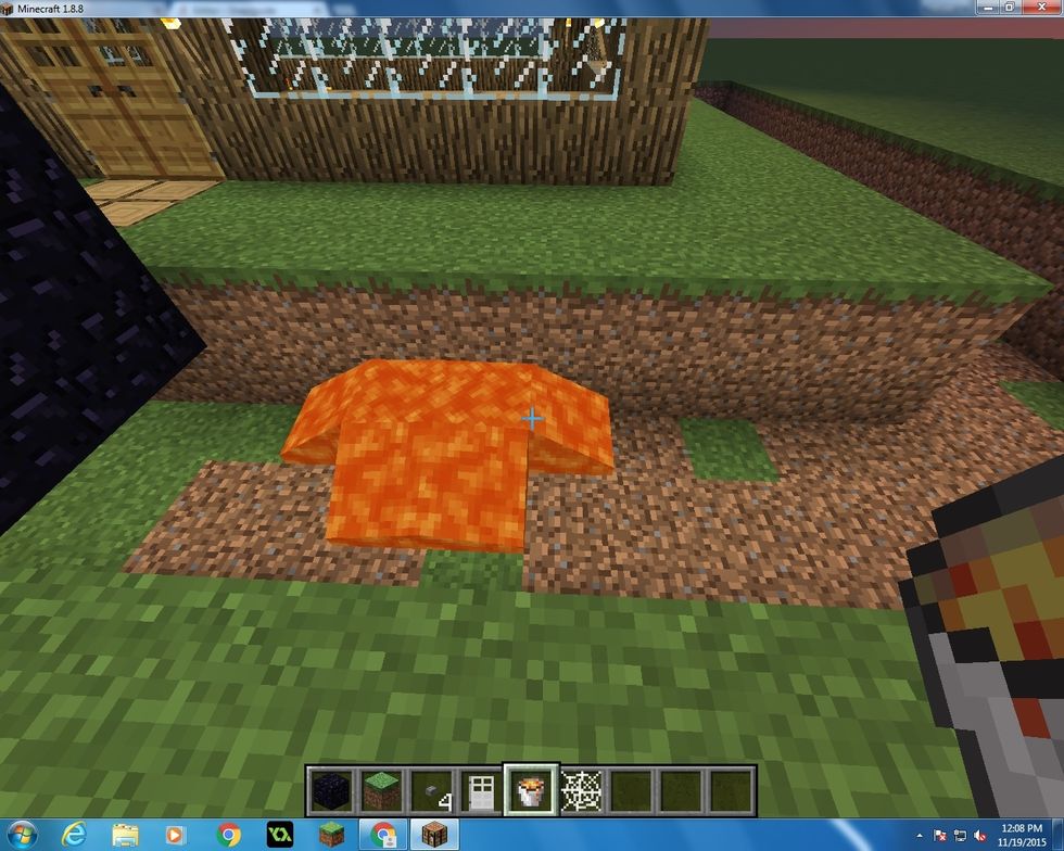 Now start to put the your lava one block up all round the house in the hole.