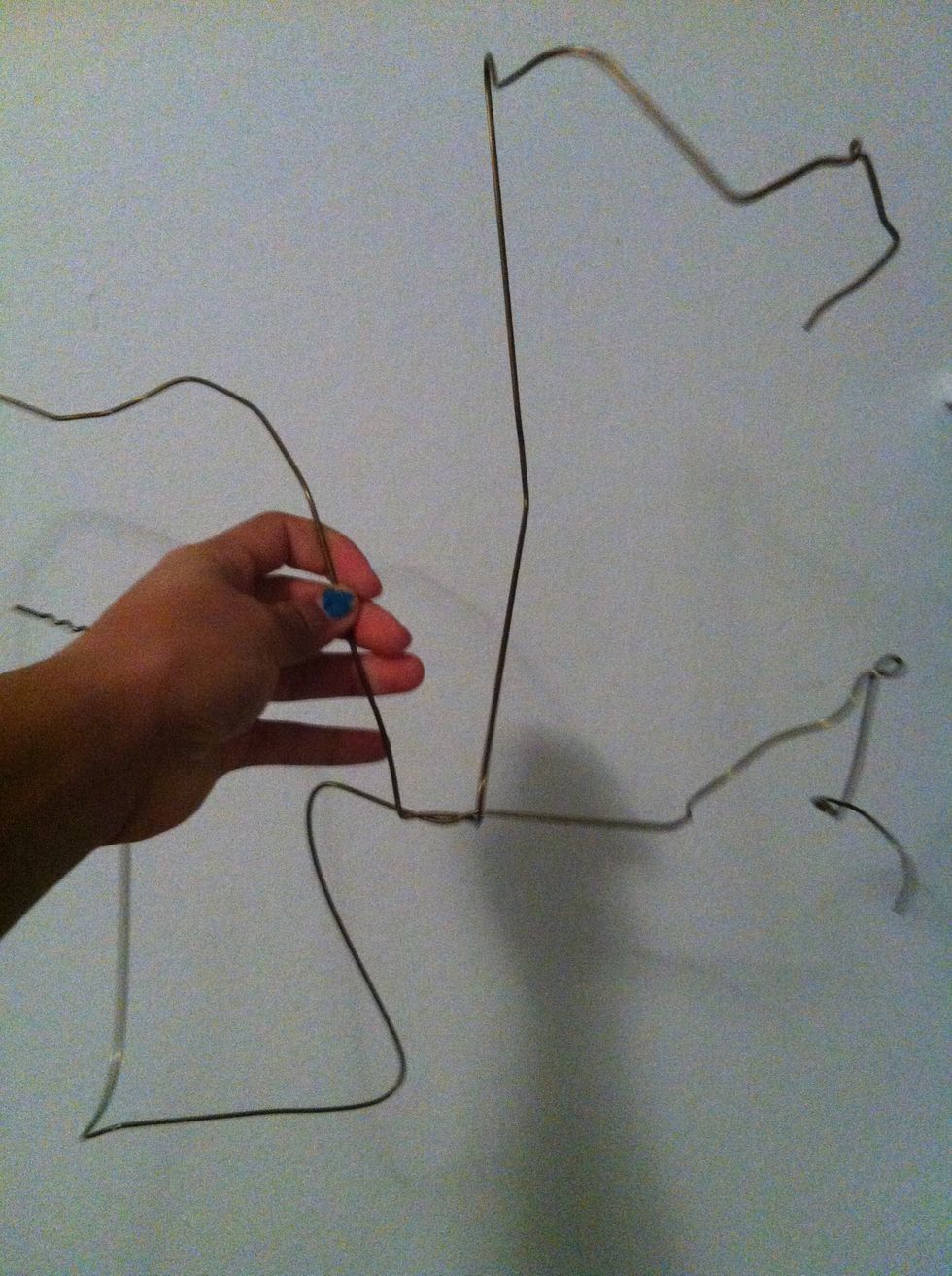Now, start to twist the wire together only where it just links. No more than that.