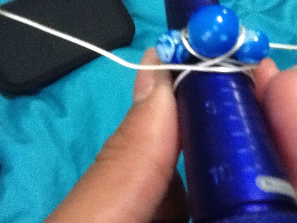 Now start wrapping the wire around the beads