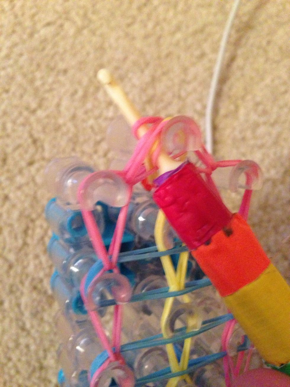 Now stick the hook through the rubber bands