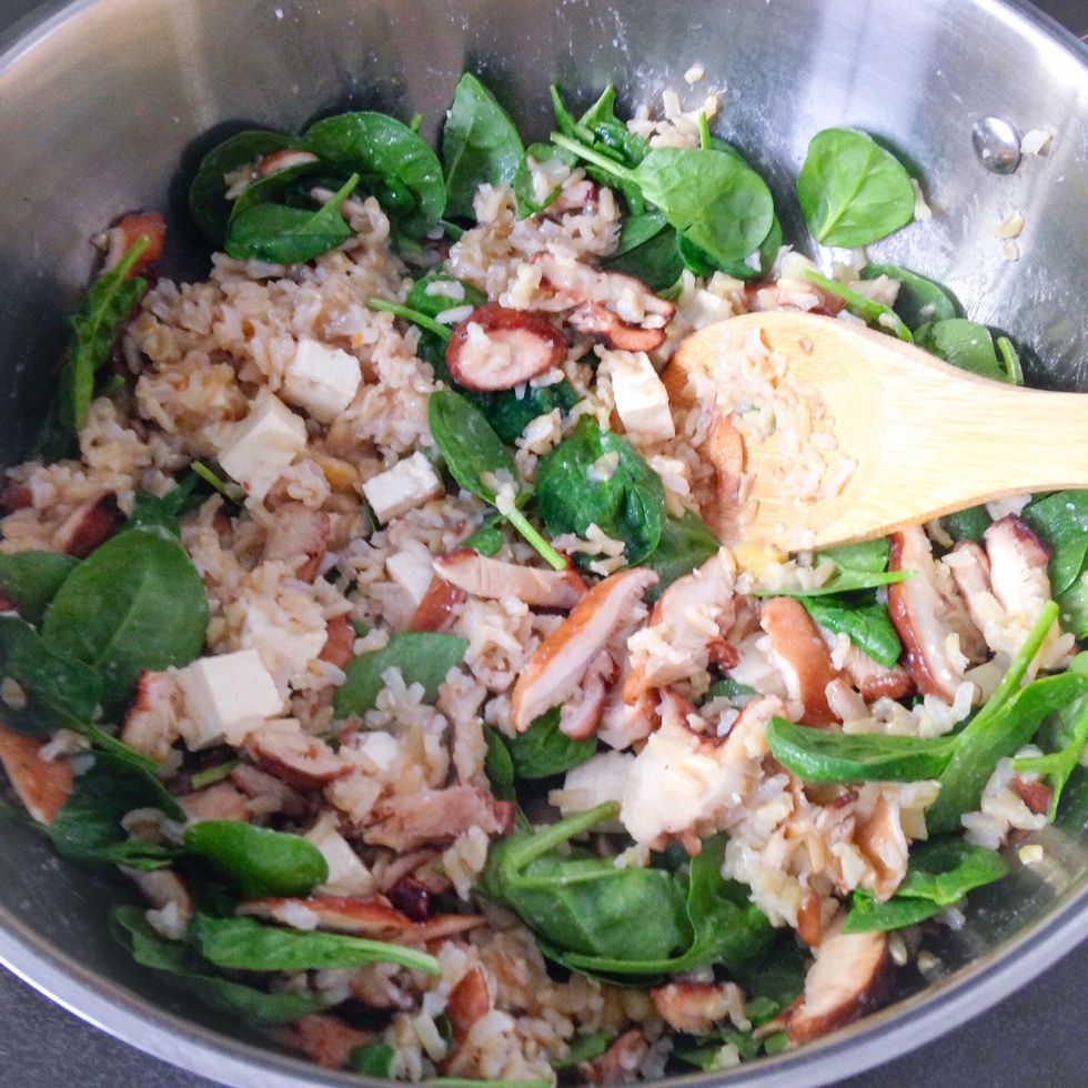 Now stir in the spinach, cilantro and scallions. Continue to cook on low, covered, for five additional minutes.