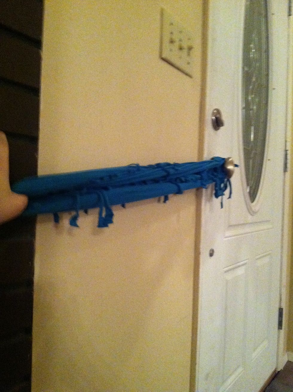 Now stretch the scarf as much as you can, so that it can go around your neck 2-3 times.