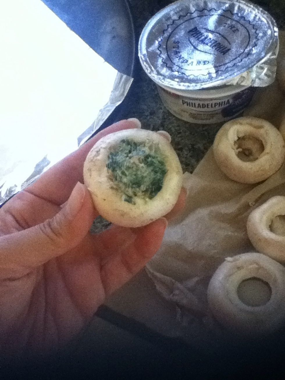 Now stuff the mixture in the mushrooms. Use a small spoon or a butter knife would be easy to do so.