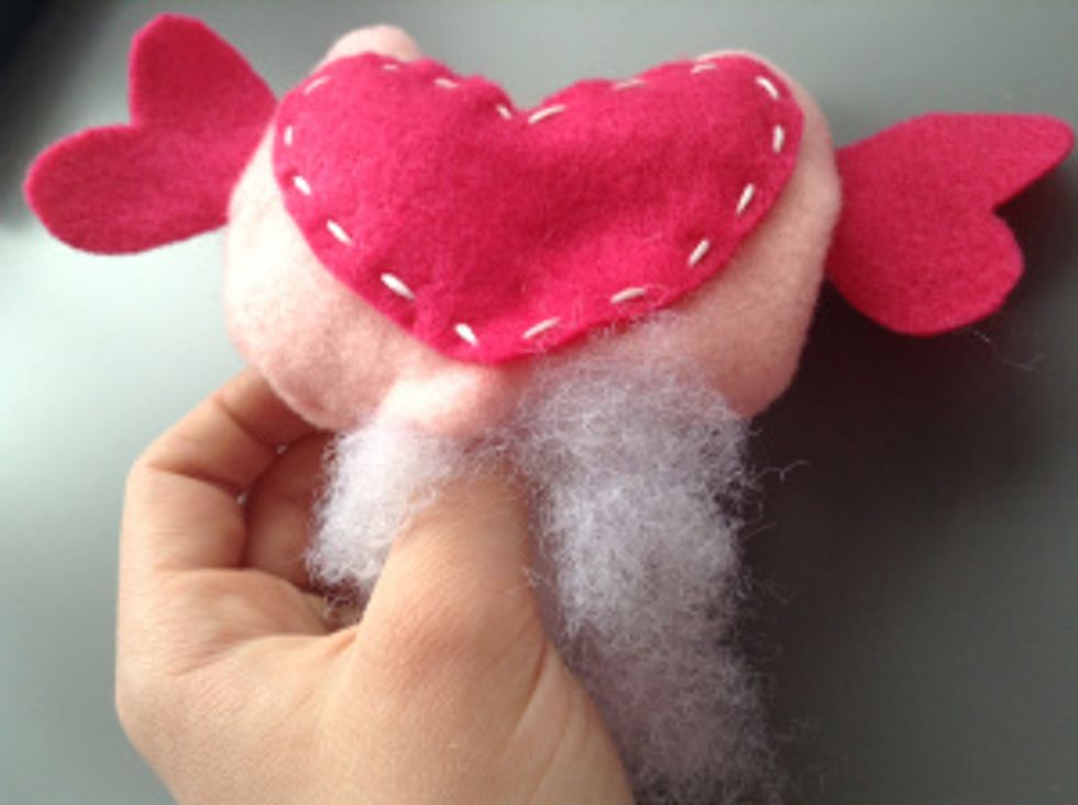 Now stuff the owl firmly and stitch up the bottom with your regular needle and thread.
