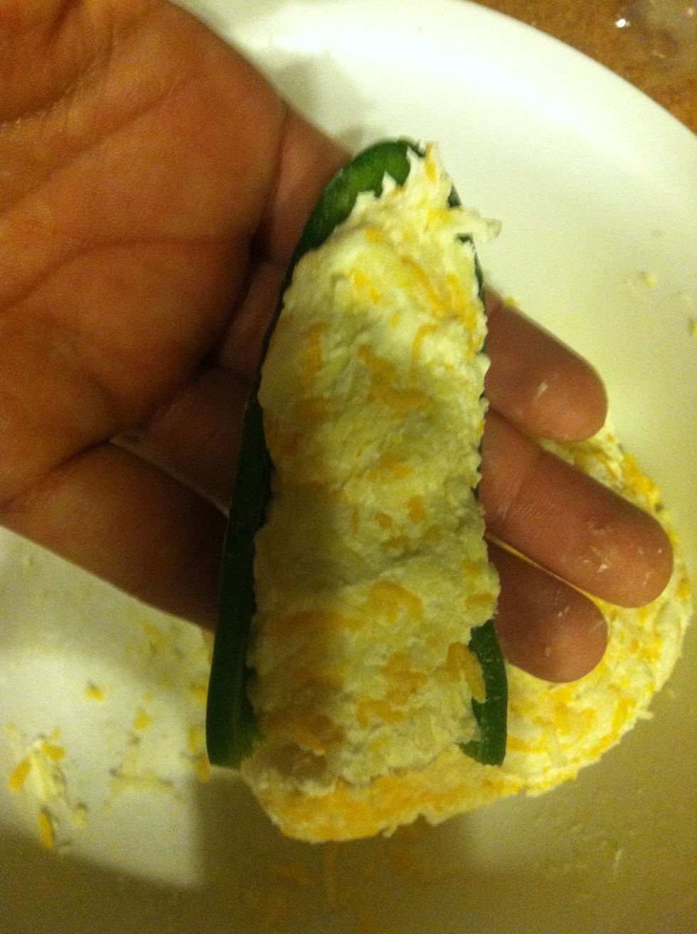 Now stuff your hallow jalape\u00f1os with cream cheese/ shredded cheeses.  Like this \u27a1