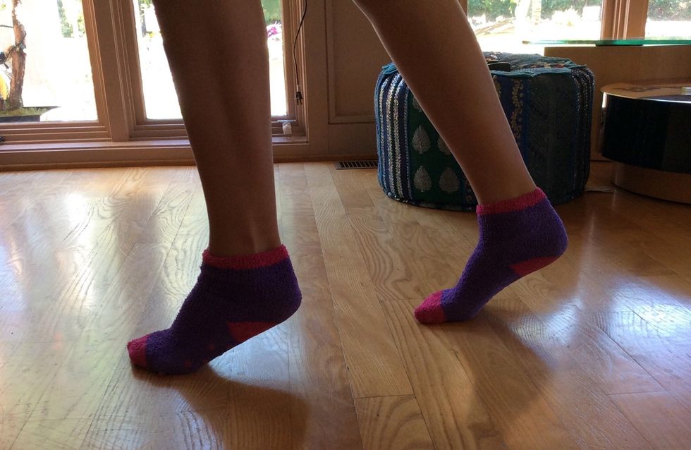 Now switch the feet positions by bringing the heel up on the foot that you just moved back.