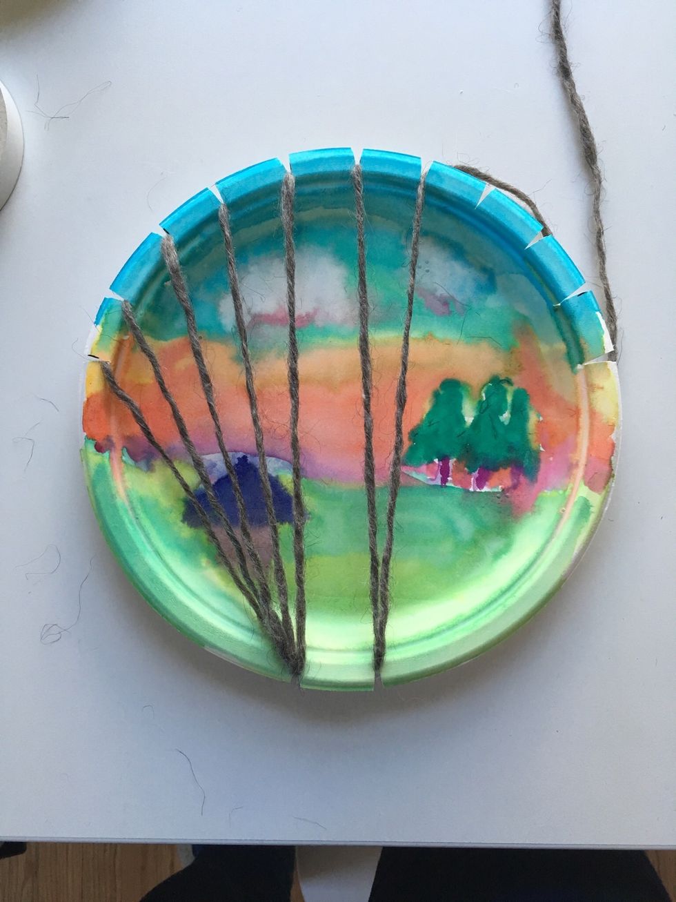 Now switch to the slot on the right at the bottom and keep going. Keep your yarn LOOSE!!