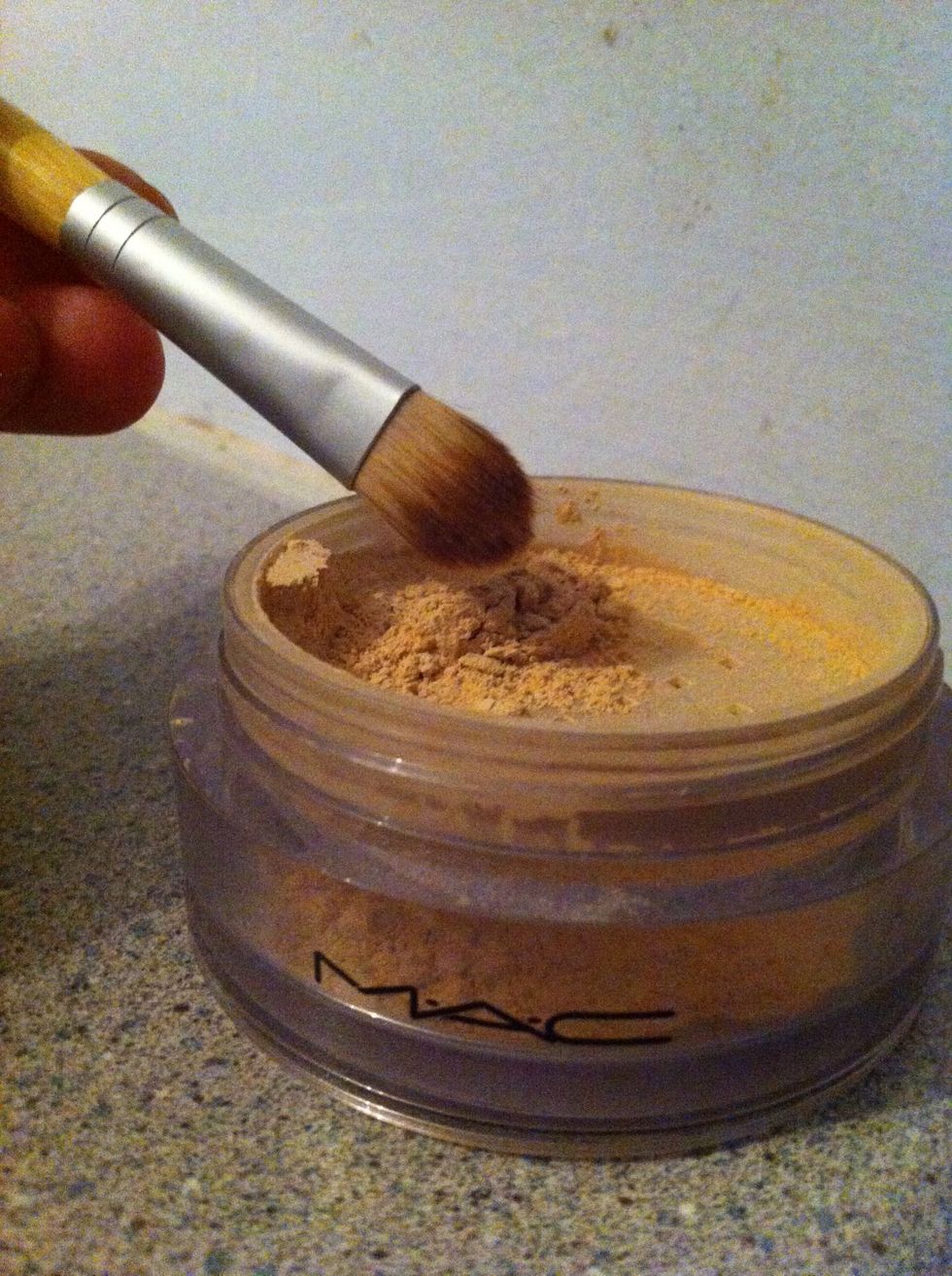 Now take a brush (or finger) and dab on some powder foundation. Again, make sure around the spot is blended, we don't want spots or a cakey, heavy face.