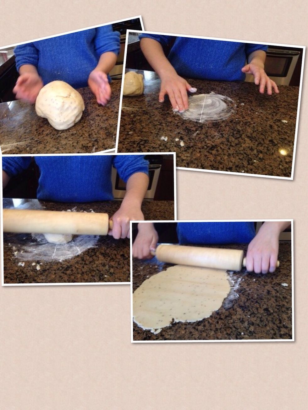 Now, take a fist sized chunk of the dough ball and knead it into a circle. Put some flour on the counter so the dough doesn't stick to the surface, and begin to roll out the dough in a thin layer.