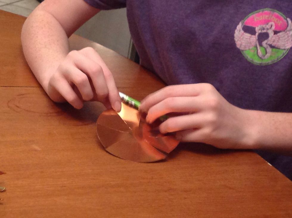 Now take a pencil a lay it at the tip of one of "pie pieces". Roll it over the pencil once or twice.