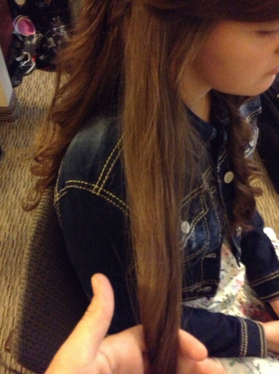 Now take a piece of hair from that same side....
