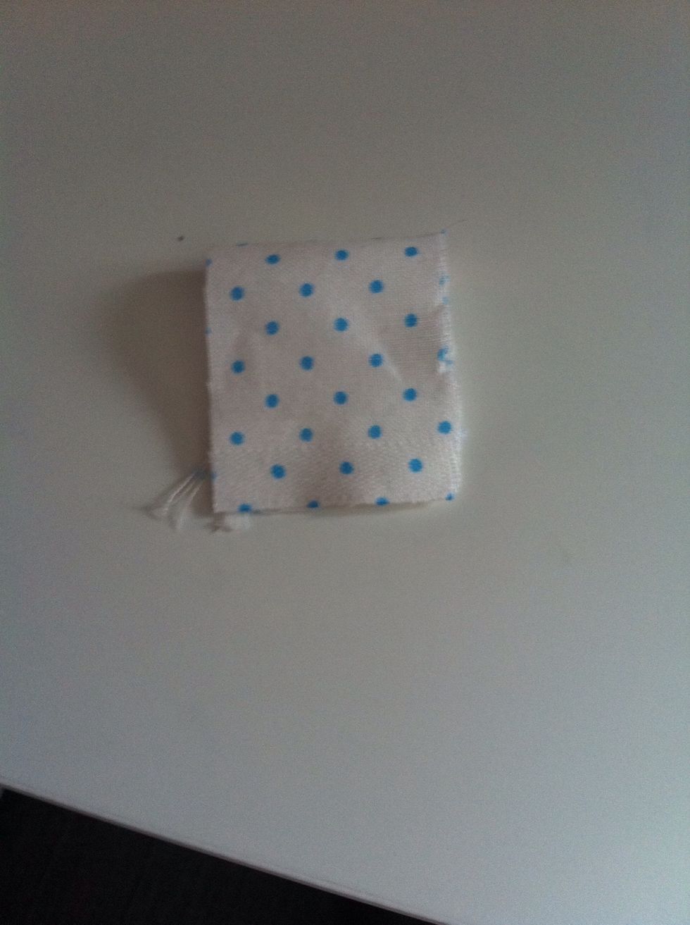 Now take a separate piece of fabric and fold it so it will fit around the middle of the bow.. Then glue on