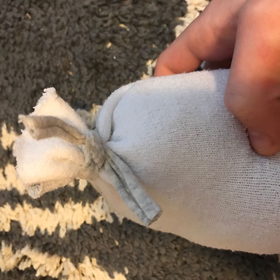 Now take an old tshirt or string and tie it shut