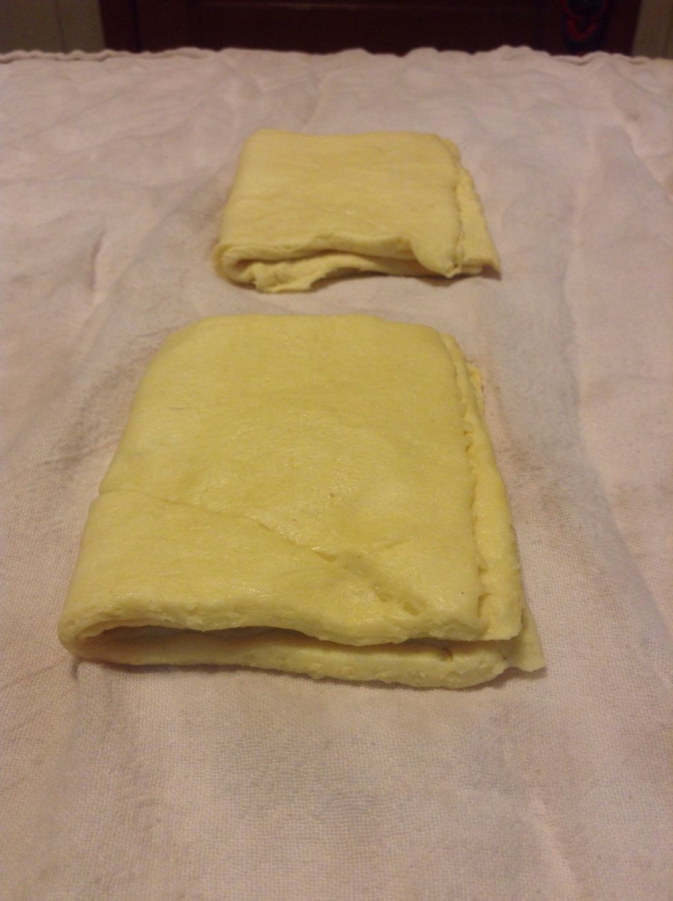 Now take each crescent sandwich and fold in half and press together.