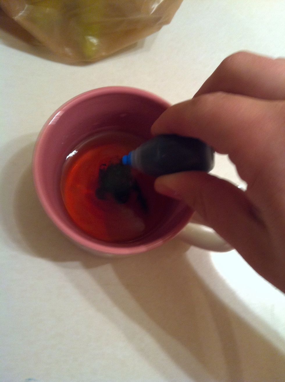 Now take food coloring and drop ten drops into the water and vinegar.