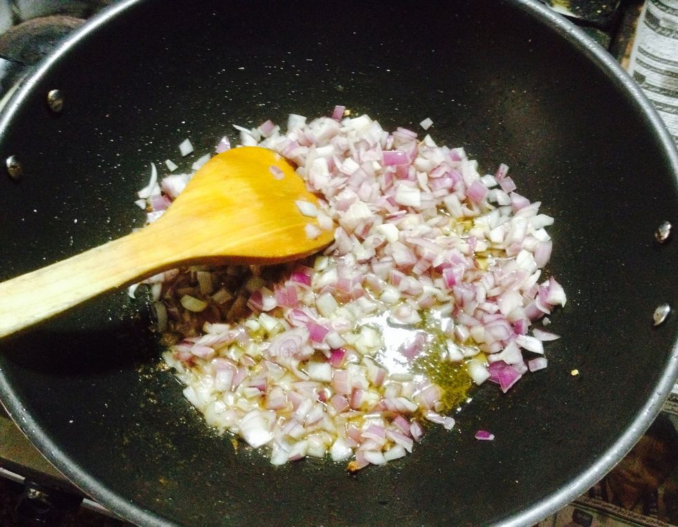 Now take out some oil from the frying pan and fry your chopped onions in the same oil. Add ginger garlic paste