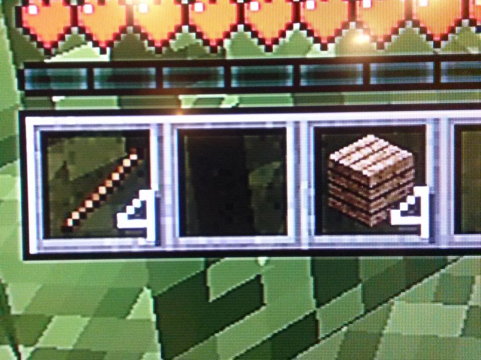 Now take out those 4 sticks from your inventory. Make sure you also have the 4 oak wood planks.