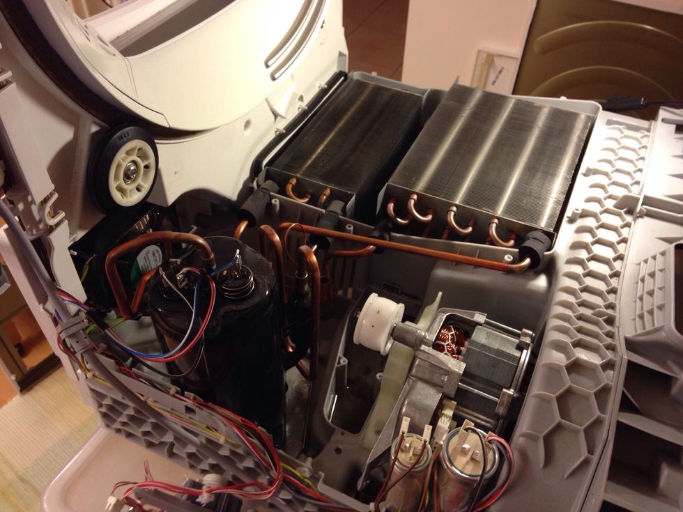 Now take out whole condensation system, radiator and motor as well.