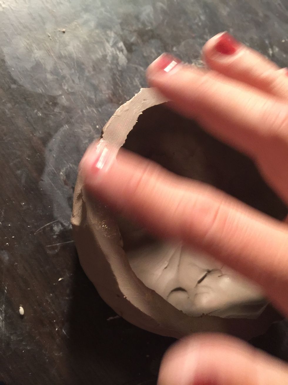 Now take some of your water and smooth out the edges so that they are nice and round.