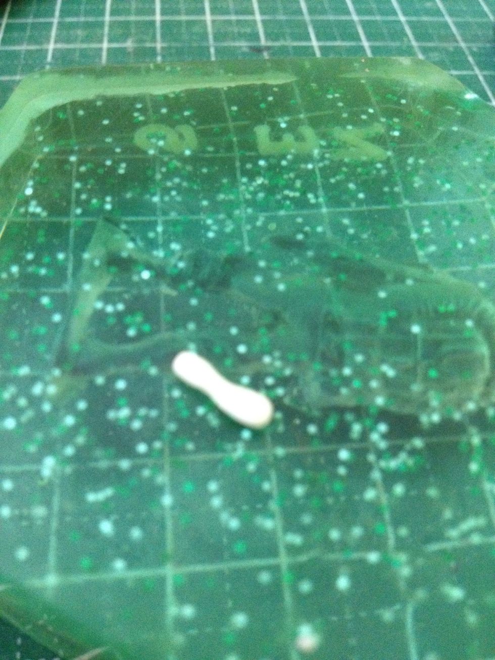 Now take some white clay and roll it from the centre outwards. This is to create the 'bone'.