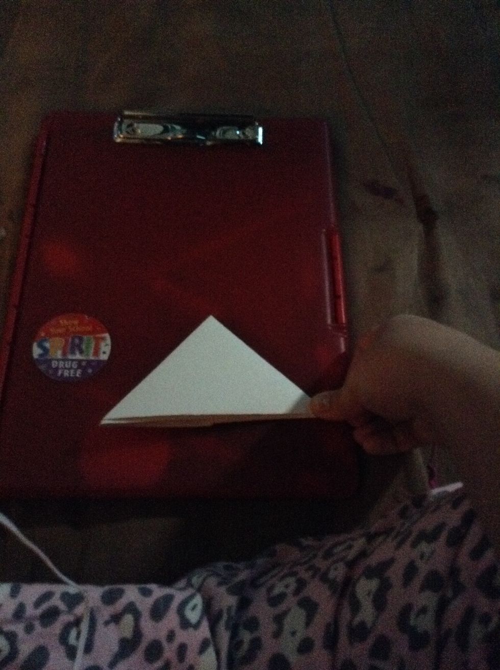 Now take the big triangle and fold it into a smaller triangle. Like this \ud83d\udc4d