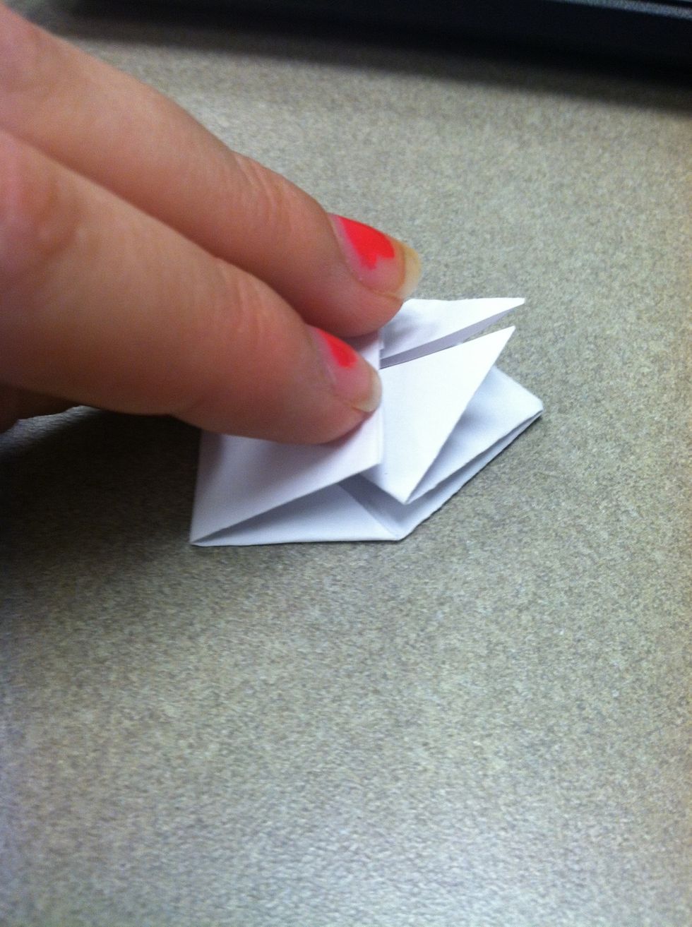 Now take the bottom and fold it so it lines up with the center of the diamond thing.