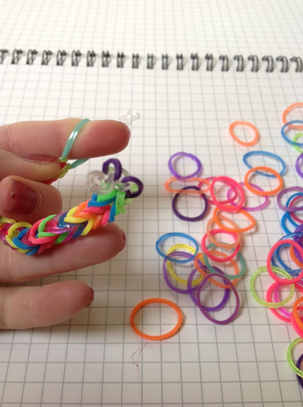 Now, take the end of the bracelet and add the clip 2 it.