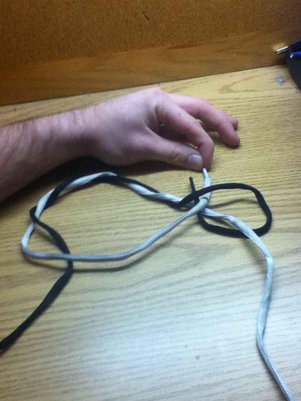 Now take the end of the other line and bring it through the loop you just created.