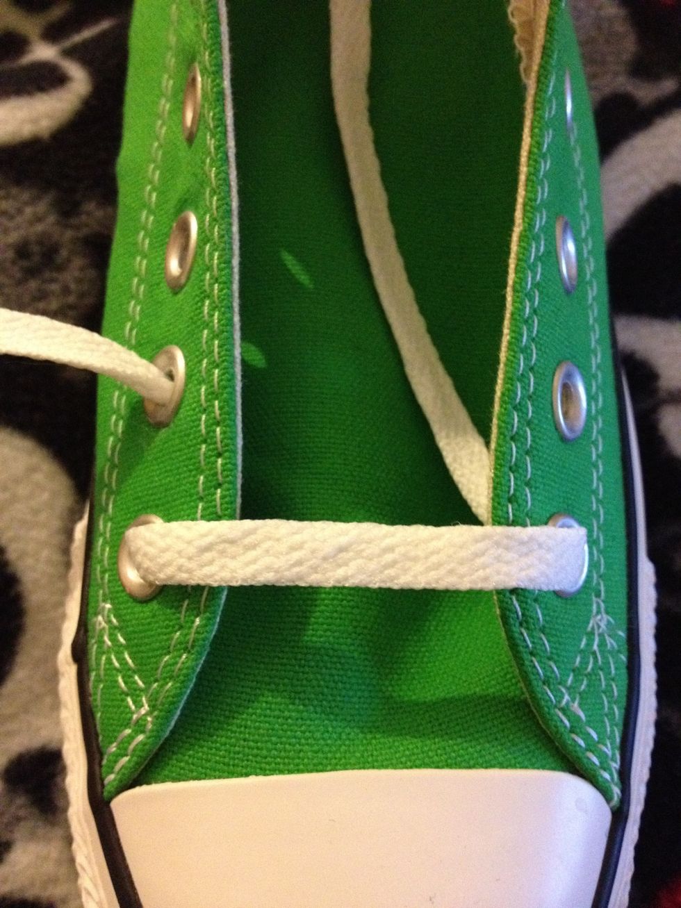 Now take the inside lace out through the second eyelet.