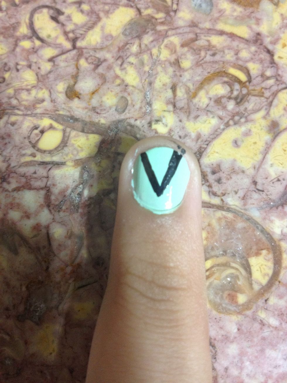 Now take the nail pen or brush and make a V on your nail.