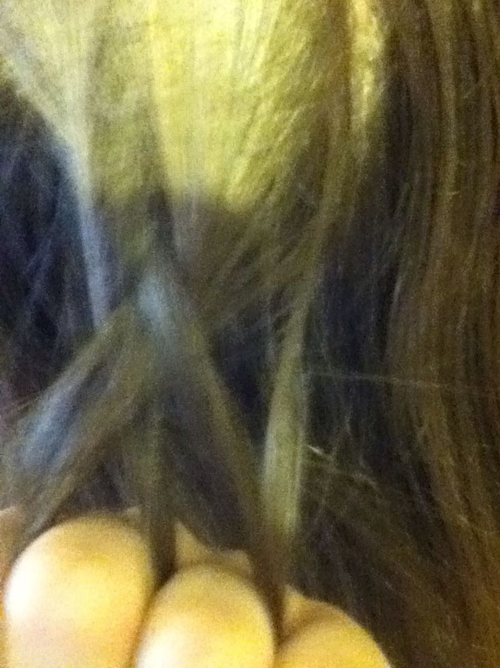 Now, take the new first piece and pull it under the middle piece.