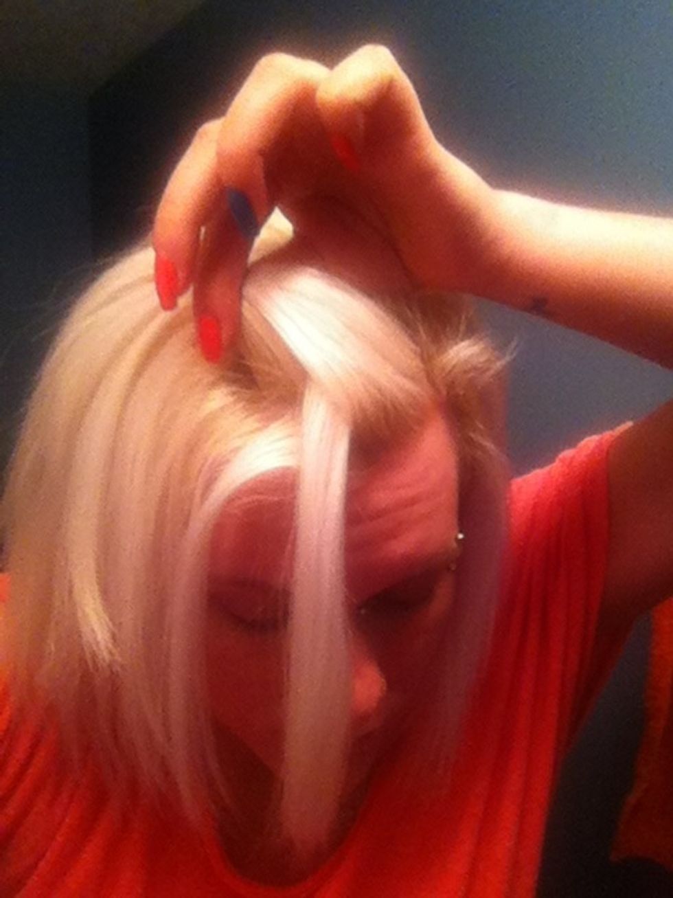 Now take the new top section and pick up a little from what's laying down (like you would in french braiding), and bring that piece sown like the first time! I apologize this picture isn't great.