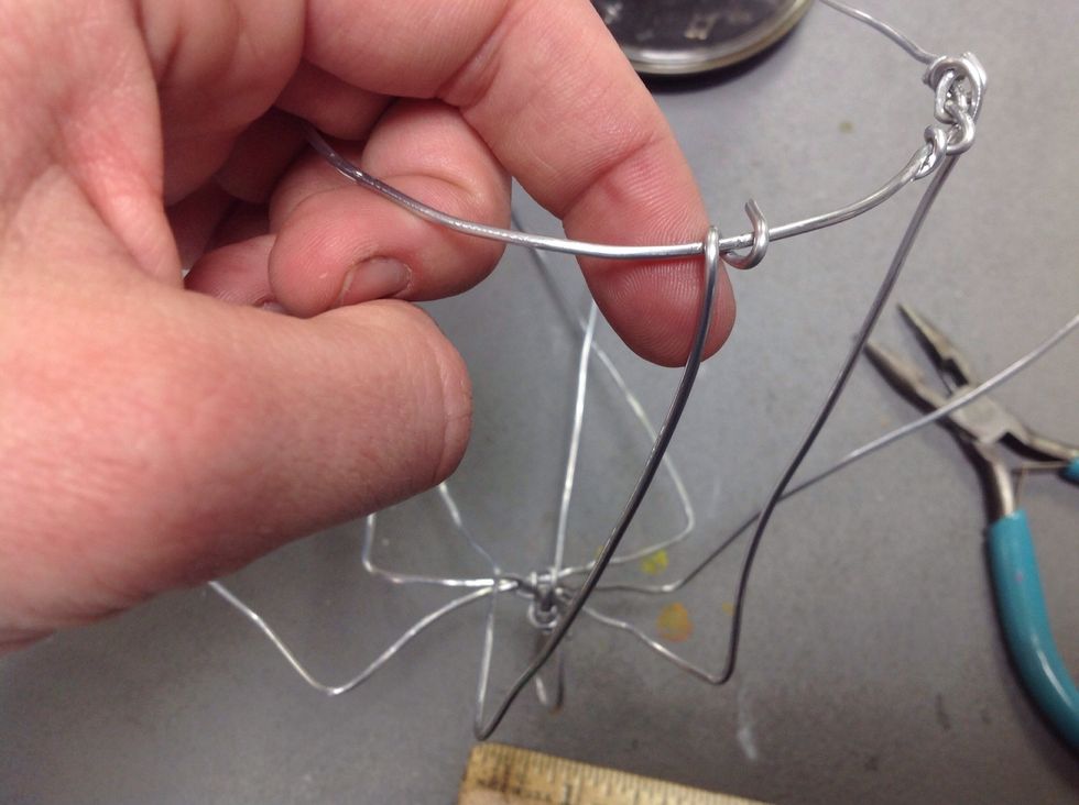 Now, take the original set of wires and attach the end of each wire to the circle you just created.